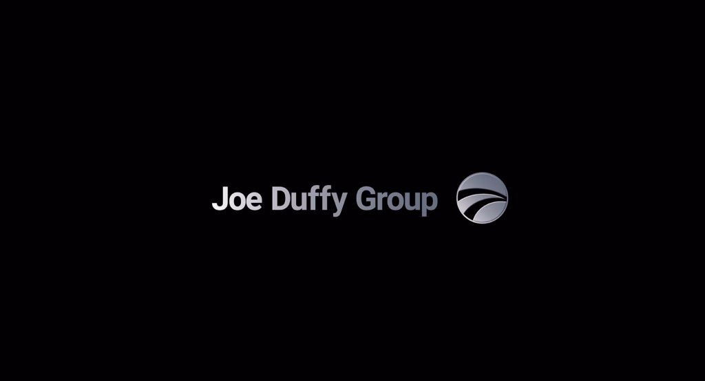 Joe Duffy Group brand identity across dealership signage and communications