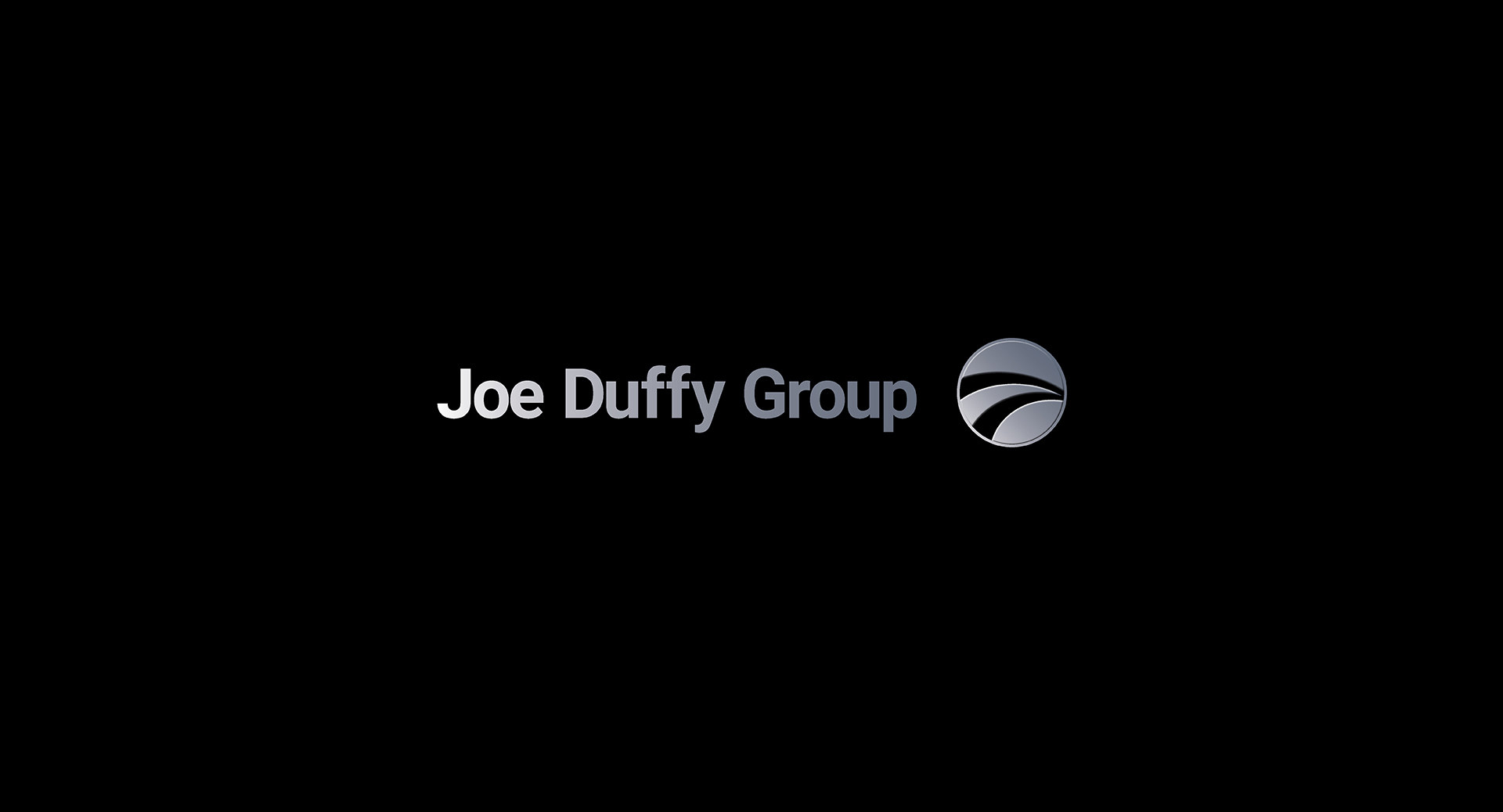 The Joe Duffy Group mark, silver wordmark with the circular swoosh device
