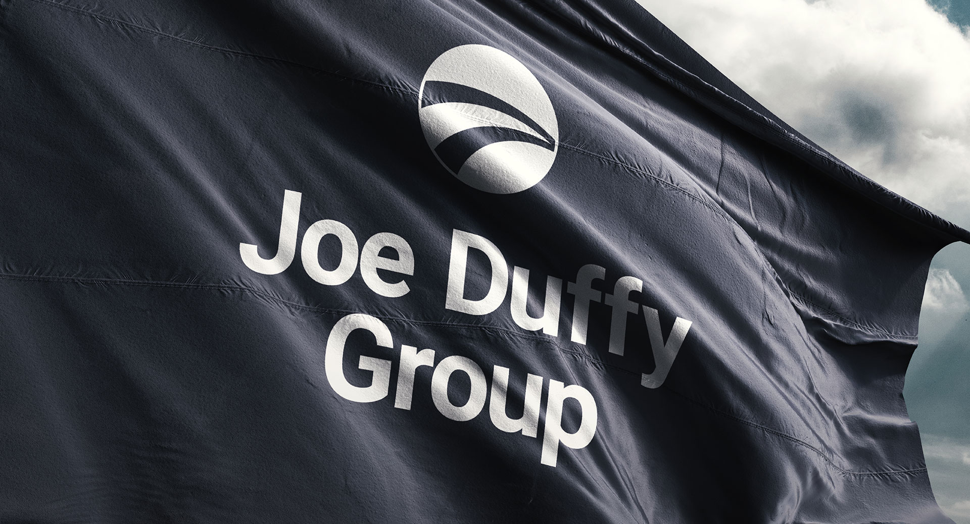 Joe Duffy Group flag in navy with the mark reversed in white