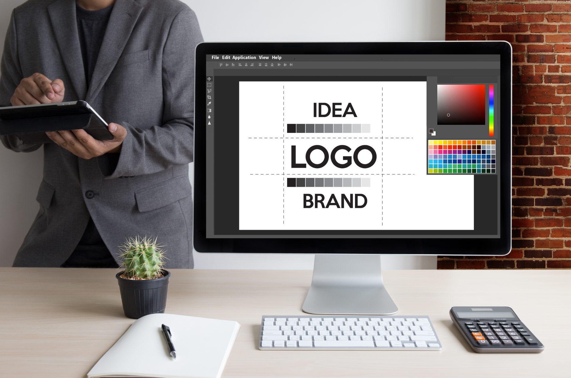 Designer sketching logo concepts on paper – how much does a logo designer cost in Ireland, Design Minds Dublin