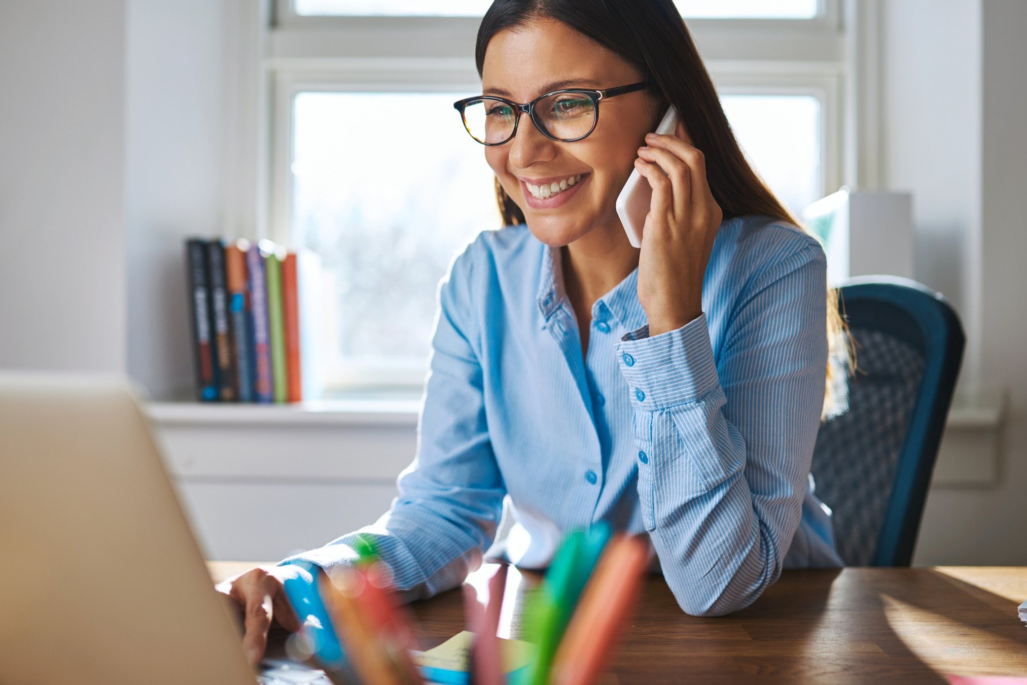 Business owner at a desk, AI search visibility for Irish businesses