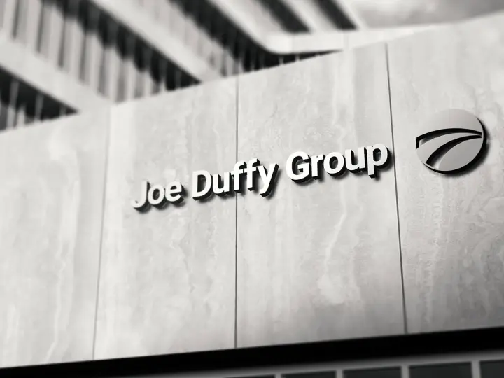 Joe Duffy Group lettering and device on a dealership facade