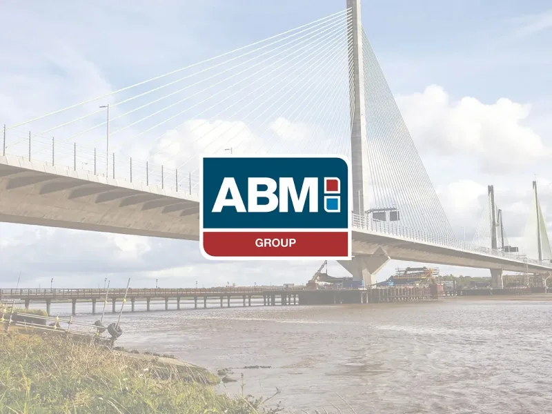 ABM Group sign in front of a cable-stayed bridge